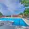 1 Mi to Lake of the Ozarks Condo with Fire Pit!