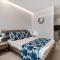 POUNEDES LUXURY SUITES