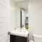 Serene and Styled Little Italy Studio full bath by Den Stays - Montréal