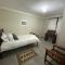 Man and Dog Log Cabin - Midrand