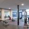 Modern 1BR Apt with Skywalk to Fiserv, Rooftop, and Parking