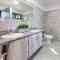 Ultramodern Townhome with an Inviting Coastal Design and Lush Outdoor Oasis with a Private Pool