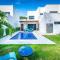 Ultramodern Townhome with an Inviting Coastal Design and Lush Outdoor Oasis with a Private Pool