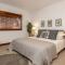 Modern Riverstone Condo with Grand Deck - Steps to Shops, Restaurants, Trails and River