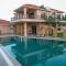 Desert Palms by StayVista in Kutch, nestled in orchards, features a swimming pool and a scenic balcony for a serene getaway - Shinaya