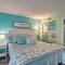 Colorful Beachfront Condo with Resort Amenities