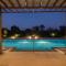 Whispering Palms by StayVista - Pool-view villa with Boutique interiors, Terrace & Lawn - Alibaug
