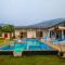 SaffronStays Turquoise Maison - 3BR pool villa with jacuzzi, bonfire & fruit garden near Lake Kalote, Karjat