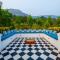 SaffronStays Turquoise Maison - 3BR pool villa with jacuzzi, bonfire & fruit garden near Lake Kalote, Karjat