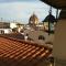 A refuge with a terrace overlooking the Duomo