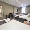 New County Hotel & Serviced Apartments by RoomsBooked