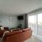 Orchard Lodge -Coastal Retreat, new build, village views, private garden and terrace