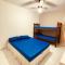 Apartamento até 10 pessoas na enseada Guarujá em condomínio clube praia piscinas salão jogos quadra futebol campo parquinho brinquedos Wi-fi Home office