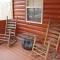 Gas fireplace, firepit, and cedar Adirondack chair - Spencer