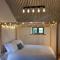 The Bothy near Tenby, Big Projector Screen, Four-poster bed, on-site HOT TUB access via Spa Pack