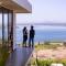 StayVista at Sunset on the Lake - Infinity Lakeview Swimming Pool with Contemporary Interiors & Lavish Amenities