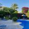 Eva Gardens corner house with stunning garden and huge swimming pool next to CORAL BAY