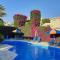 Eva Gardens corner house with stunning garden and huge swimming pool next to CORAL BAY