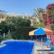 Eva Gardens corner house with stunning garden and huge swimming pool next to CORAL BAY