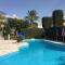 Eva Gardens corner house with stunning garden and huge swimming pool next to CORAL BAY