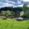 The Granary at Pentregaer Ucha, tennis court & lake. - Oswestry