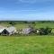 The Granary at Pentregaer Ucha, tennis court & lake. - Oswestry