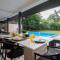 Sunshine Bloom by StayVista - Your Oasis with Pool, Lawn, Gazebo, and Poker Table - Lonavala