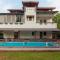 Sunshine Bloom by StayVista - Your Oasis with Pool, Lawn, Gazebo, and Poker Table - Lonavala