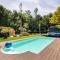 Green Tiny House with shared pool