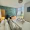 The Alice Apartment - by Coastline Retreats - Stunning Balcony Apartment with Sea Views - Alice in Wonderland Themed Secret Room - Luxury Copper Bath in Master Bedroom