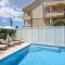 Apartments Mastelic with pool next to the beach
