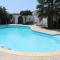 Mediterranean poolside garden cottage
