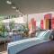 Cosy Loft tarif avec 1 ou 2 chambres 2 ou 4 personnes, vue parc et piscine