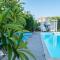 Greek Island Style 2 bedroom Villa with Pool next to the Sea