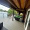 Woodpecker Log Cabin with hot tub, pizza oven bbq entertainment area, lakeside with private fishing peg situated at Tattershall Lakes - Tattershall