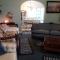 1 mile to Fort Sill! The CaroleBelle Cottage sleeps 8 with hottub,grills,firepit
