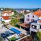 Apartments with a swimming pool Preko, Ugljan - 14163 - Preko