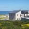Pearl Haven, coastal comfort just steps from the shore!