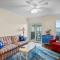 Cheery coastal condo with balcony, AC, W/D, 2 pools, grills, & beach access
