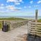 Cheery coastal condo with balcony, AC, W/D, 2 pools, grills, & beach access