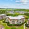 Cheery coastal condo with balcony, AC, W/D, 2 pools, grills, & beach access