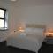 Cozy & Bright 2-Bedroom Apartment with Large Balcony and Free Parking