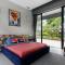 Colossus by StayVista - Riverside luxury villa in Khalapur with a Spacious pool, Sauna, Private theater, Gazebo & Lawn