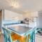 Cozy Coastal Condo Steps from the Beach with Deck Views