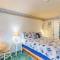 Cozy Coastal Condo Steps from the Beach with Deck Views