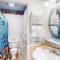 Cozy Coastal Condo Steps from the Beach with Deck Views