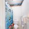 Cozy Coastal Condo Steps from the Beach with Deck Views