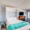 Cozy Coastal Condo Steps from the Beach with Deck Views
