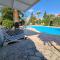 Mediterranean poolside garden cottage