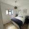 Centrally located modern 2-bedroom home & parking